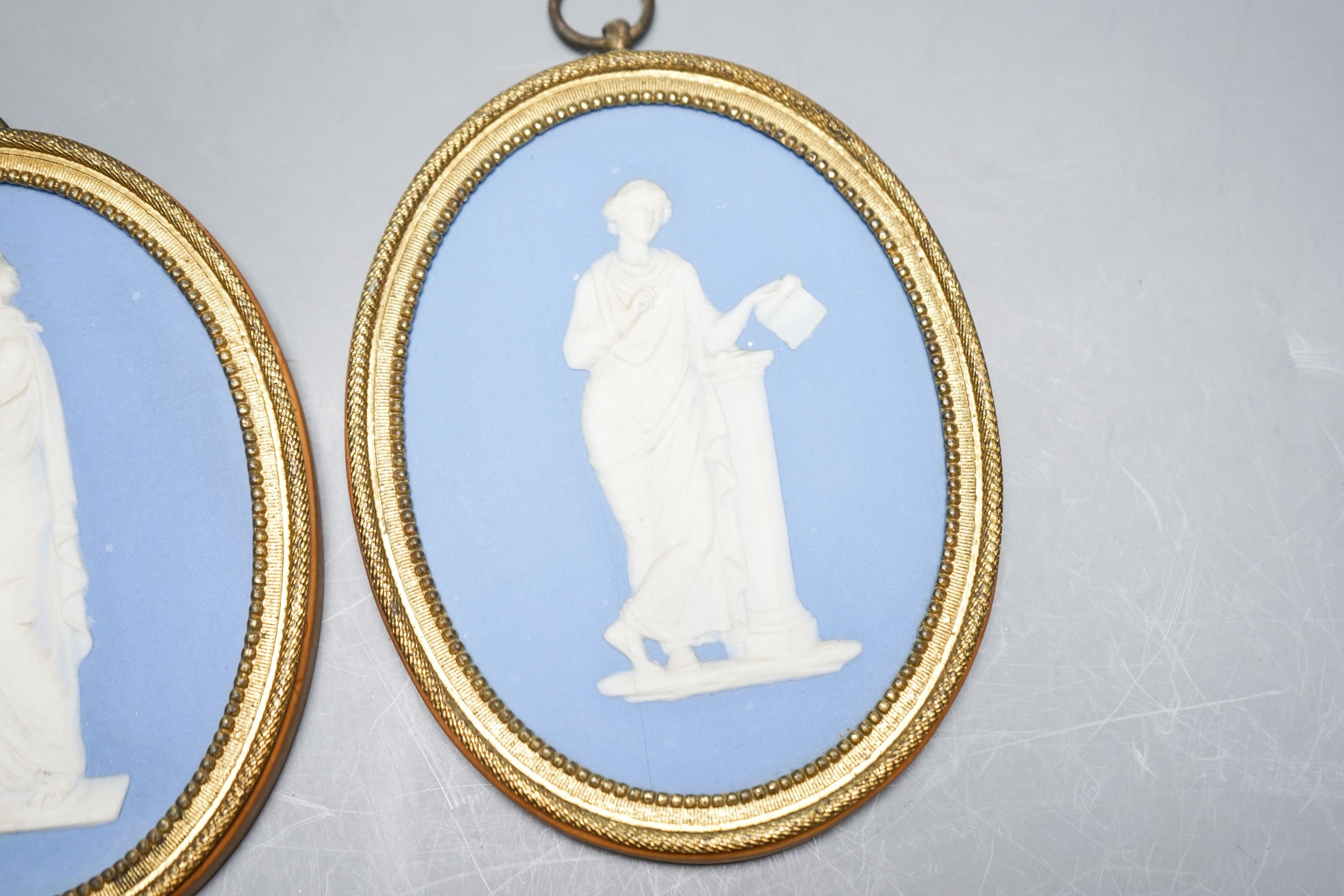 A pair of blue and white jasper oval miniature plaques, presumably Wedgwood, 16cm